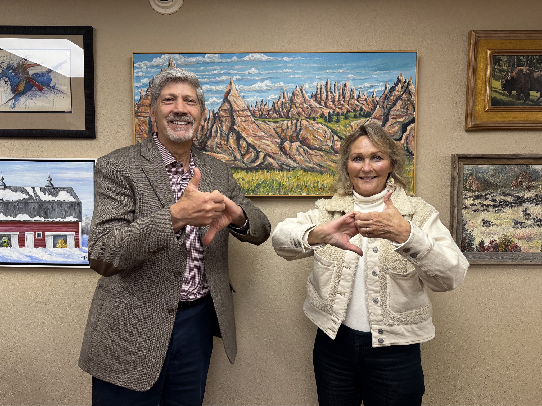 Photo of Sandy Rhoden and Joel Jundt promoting Buckle Up Phone Down. 